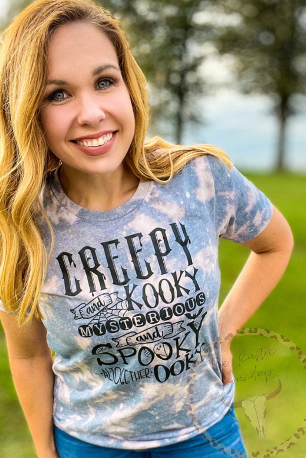 Woman outdoors wearing acid washed Creepy and Kooky Bleached T-Shirt, Addams Family, vintage style tee