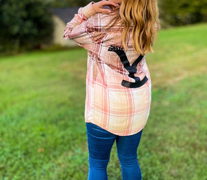 Midsize woman outdoors wearing bleached flannel with Yellowstone, influencer style, ootd