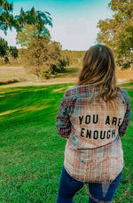 Load image into Gallery viewer, Midsize woman outdoors wearing bleached flannel with You Are Enough
